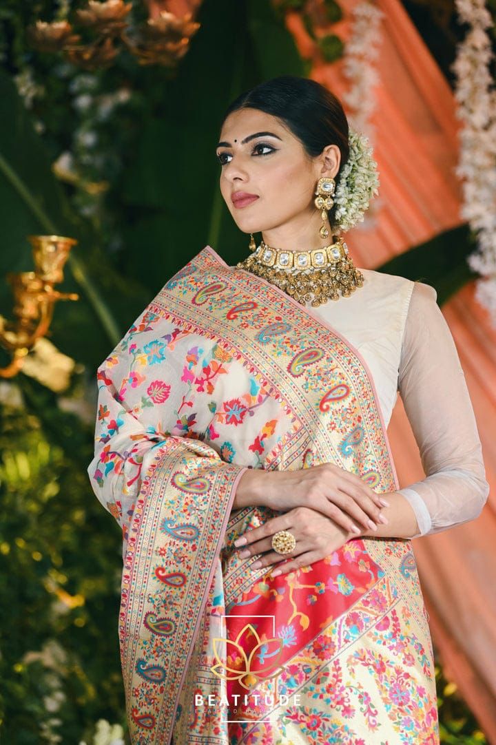 Stylish Cream Banarasi Silk Saree With Gleaming Blouse Piece