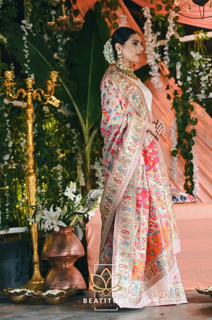 Stylish Cream Banarasi Silk Saree With Gleaming Blouse Piece