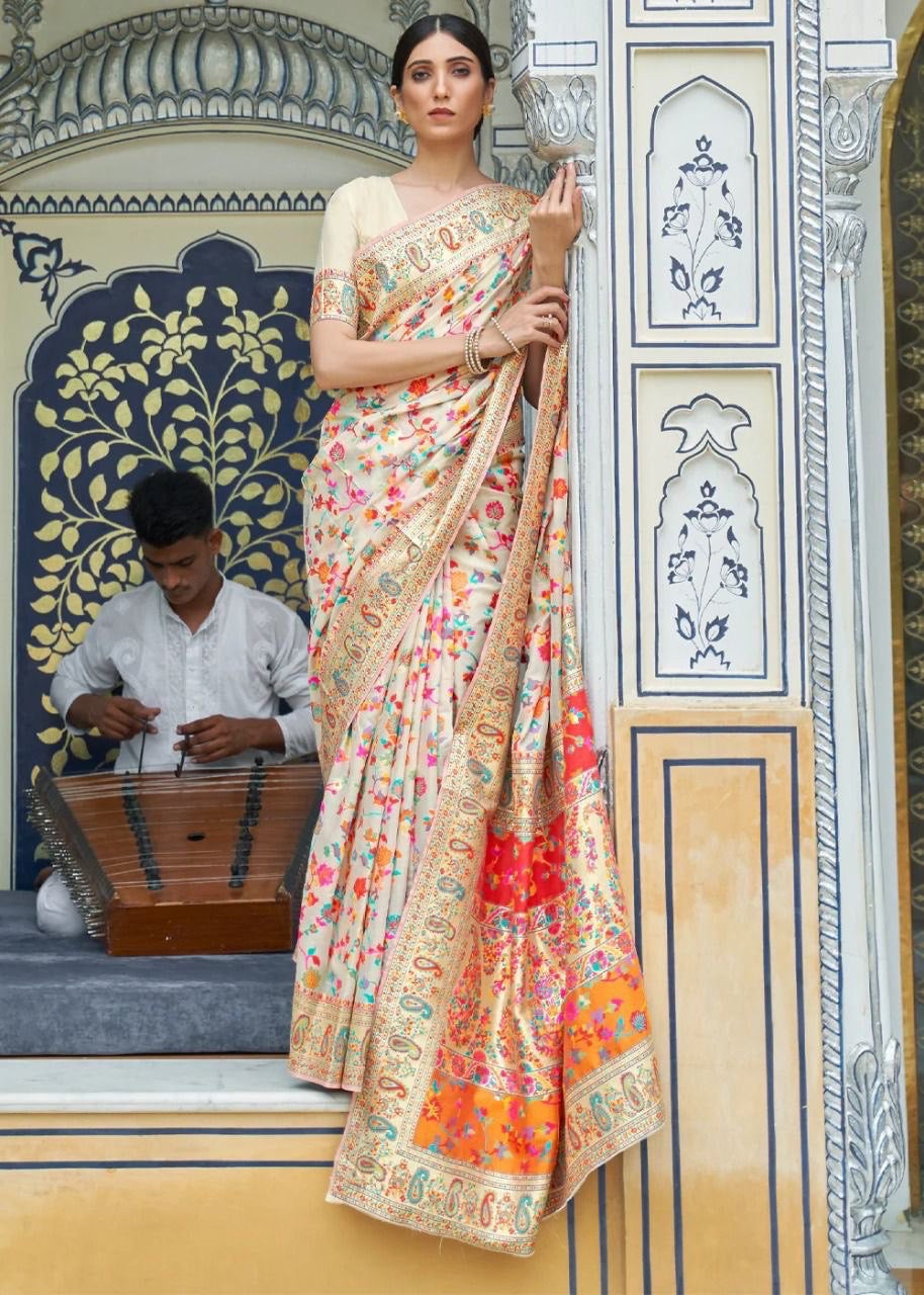 Stylish Cream Banarasi Silk Saree With Gleaming Blouse Piece
