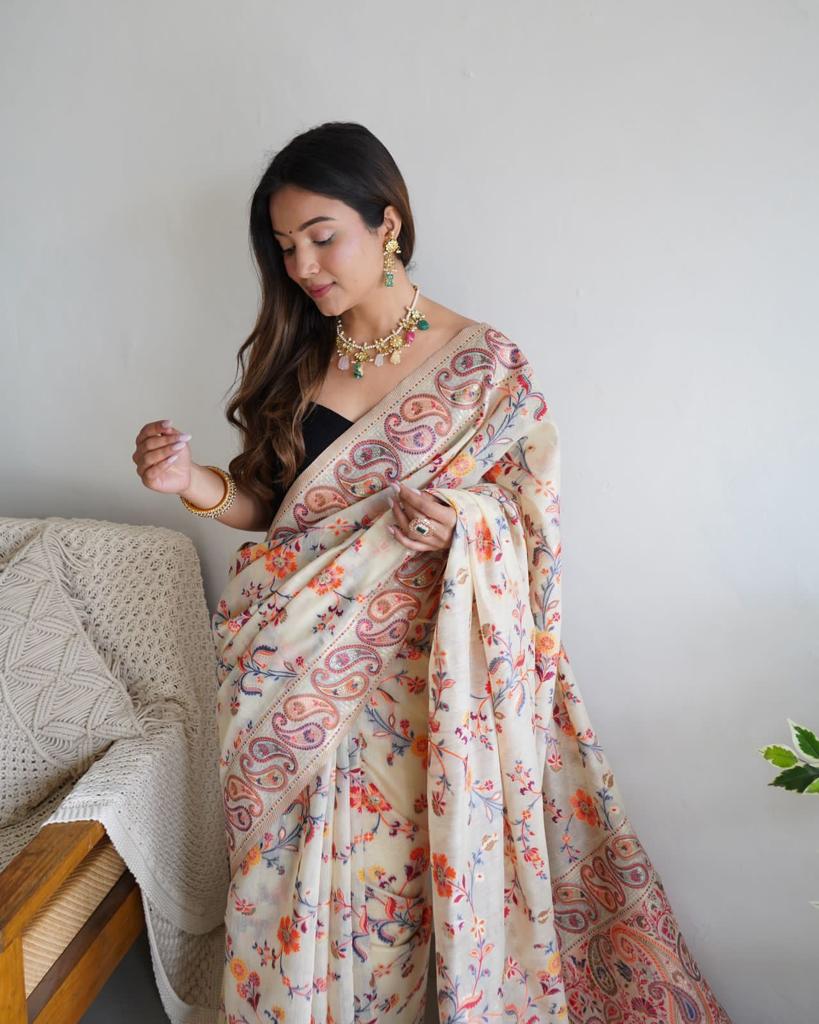 Stylish Cream Banarasi Silk Saree With Gleaming Blouse Piece